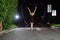 Asian girls dancing ballet on the road at night