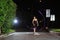 Asian girls dancing ballet on the road at night