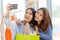 Asian girls with friend happy enjoy shopping happiness moment fun selfie in shop together