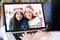 Asian girls make video call for greeting in Christmas holiday celebration by laptop computer, new normal, online party celebrating