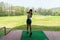 Asian golfer woman swing golf ball practice at golf