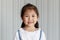 Asian good looking girl child is smiling, Happy little girl while posing at the camera on white background