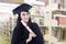 Asian graduate wearing graduation gown at library