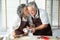 Asian Grandmother kissing Grandfather while their baking cookies