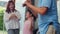 Asian grandparents and granddaughter listen to music and dance together at home. Senior Chinese, grandpa and grandma happy spend