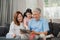 Asian grandparents and granddaughter using tablet at home. Senior Chinese, grandpa and grandma happy spend family time relax with