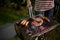 Asian group of friends having outdoor garden barbecue laughing w