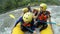 Asian Group Of People Whitewater Rafting