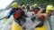 Asian Group Of People Whitewater Rafting