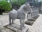 Asian guards and horse grey stone statues at Khai Dinh Tomb