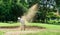 Asian handsome golfer hitting the ball on the sand. Speeds Cause