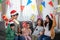 Asian Happy family with daughter in Santa hats gathered together on Christmas time and enjoy gifts box