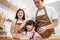 Asian happy family stay home in kitchen spend time together baking bakery and foods. Little preschool kid learn crack egg from par