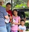 Asian heritage father with daughter and son buys plants at garden show Tulsa Oklahoma USA 4 13 2018