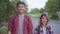 Asian hiker couple trekking in forest. Young happy backpack man and woman smiling to camera, travel nature and adventure trip,