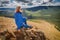 Asian hiker woman enjoys climbing on high mountain in national Park. Beautiful view of the valley