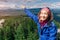 Asian hiker woman enjoys climbing on high mountain in national Park. Beautiful view of the valley