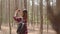 Asian hiker woman trekking in forest. Young happy backpack girl using phone take pictures photo while travel nature and adventure