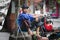 Asian homeless man barefoot with a gas cylinder in a street of hanoi, Vietnam