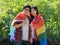 Asian homosexual couples use a lgbt flag to cover  and hold hands in love