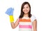 Asian housewife with plastic glove and rag