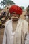 Asian Indian Man with Red Turban and Luxurious Mustache in Village
