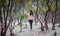 An asian Indonesian female standing in the woods of a volcanic crater lake