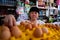 Asian Indonesian women arranging eggs inside small local family-owned business store, locally called warung. Selective Focus