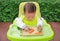 Asian infant baby boy eating by Baby Led Weaning BLW. Finger foods concept