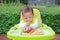 Asian infant baby boy eating by Baby Led Weaning BLW. Finger foods concept