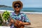 Asian, Japanese teenager playing the Ukulele on a beach in Chiba Japan