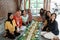 Asian javanese traditional eating together sitting on floor