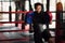 Asian kickboxing trainer in boxing gym