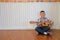 asian kid boy child playing guitar ukulele. children leisure act