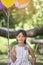 Asian kid holding group of balloon