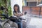 asian kid playing and washing motorbike scooter at home