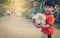 Asian kid in poor village playing with soccer ball