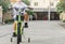 Asian kid students exercise bicycle outdoor in front of the village for lifestyle fun happy ride biking training enjoying Learn to