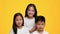 Asian Kids Taking Off Face Mask Smiling Over Yellow Background