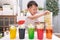Asian kindergarten boy having fun making Rainbow Cabbage Experiment, Kid-friendly easy science experiments at home concept