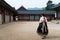 Asian Korean woman dressed Hanbok in traditional dress walking i