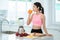 Asian lady drink a mixed fruit for healthy