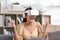 Asian lady wears VR headset having fun experience wearable virtual reality digital innovation technology happy moment. Excited and