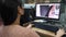 Asian lady working editing image photographs using a desktop computer application