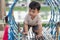 Asian little baby boy enjoy with outdoor zone kid park