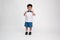 Asian little boy in student uniform with shows two fingers sign  on white background.