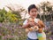 Asian little child boy holding, hugging favorite teddy bear with smiling happy face.