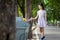 Asian little child girl hand holding plastic bottle,putting plastic water bottle in recycling bin,tourist woman hand throwing