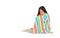 Asian little childd girl sitting wrapped covered in soft multicolor blanket and looking down isolated on white background with