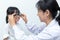 Asian Little Chinese Girl Doing Eyes Examination by ophthalmologist